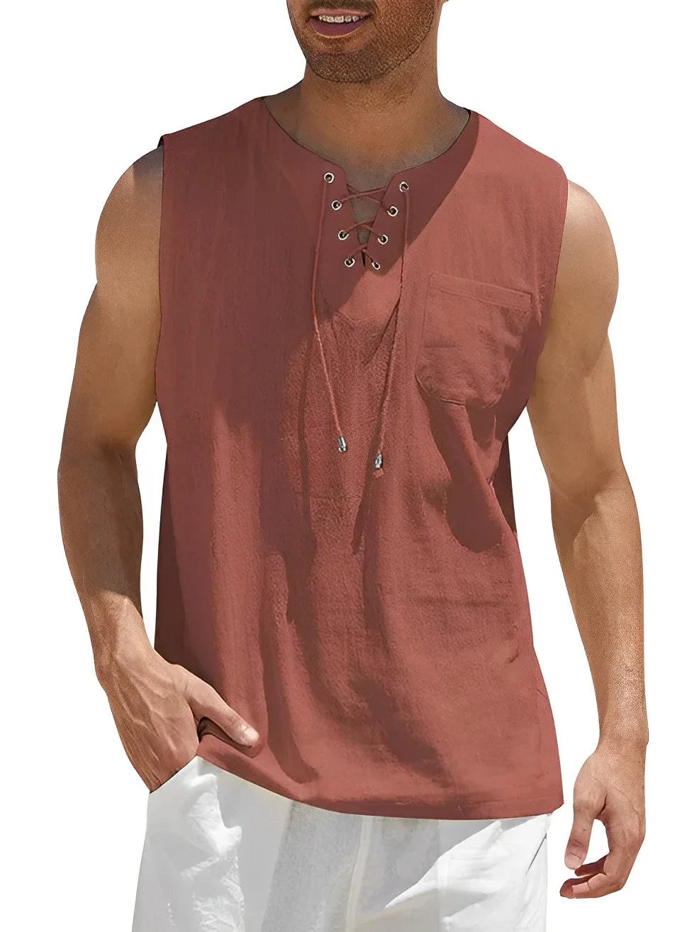 Front view of the sleeveless top in a brick rust tone with lace-up neckline and pocket
