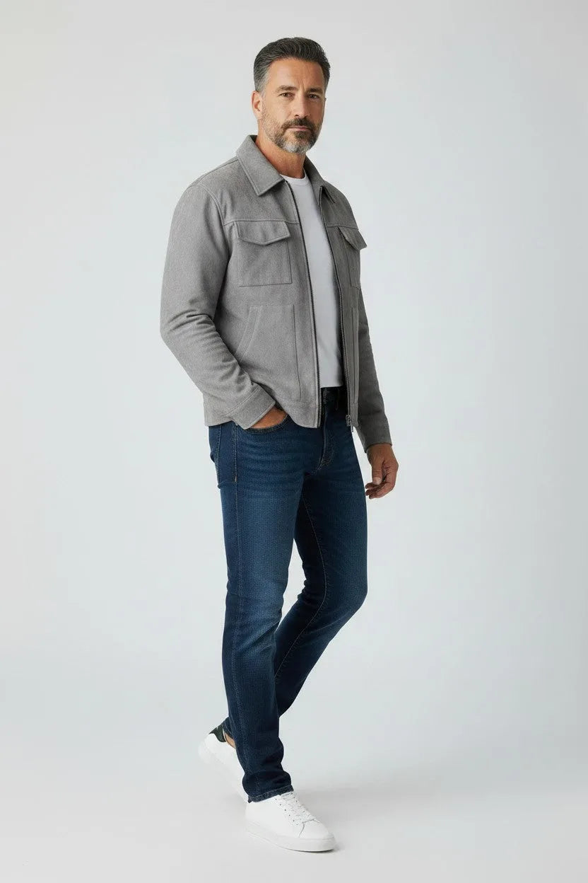Angled view of the grey suede-effect jacket worn open with a white tee, highlighting the relaxed fit and zip closure.