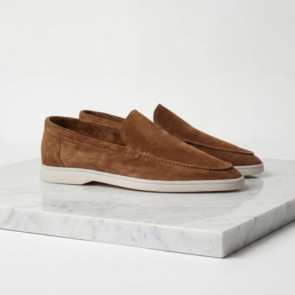 Close-up of the suede texture on the vamp of a light grey loafer