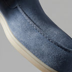 Close-up of the apron seam and suede texture on a yacht blue loafer