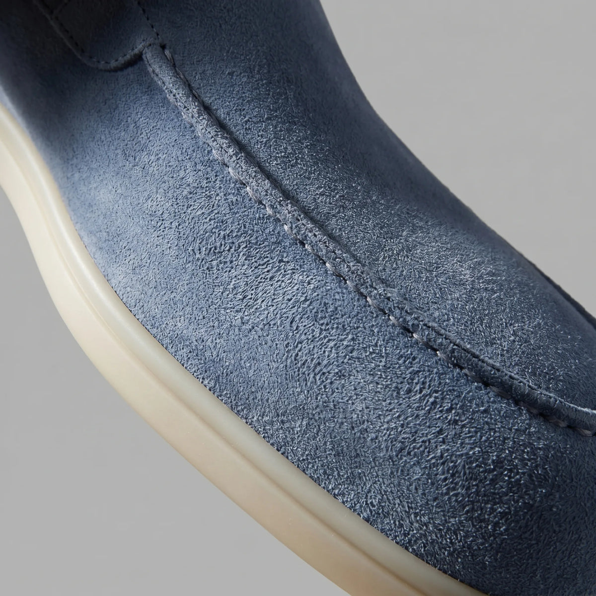 Close-up of the apron seam and suede texture on a yacht blue loafer
