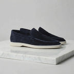 Rear view of yacht blue suede loafers showing the heel shape and cream sole