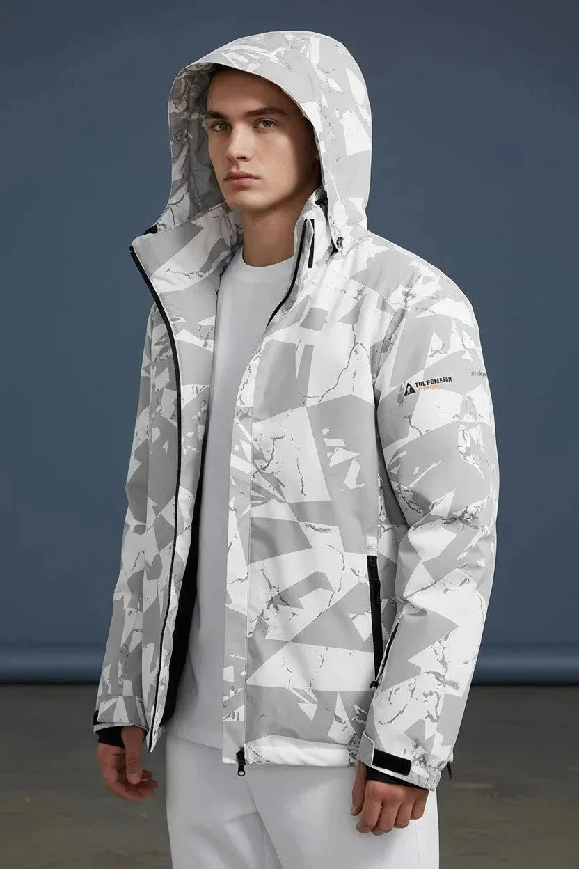 Front view of a man wearing a grey and white camo print hooded jacket with the hood up over a light grey tee
