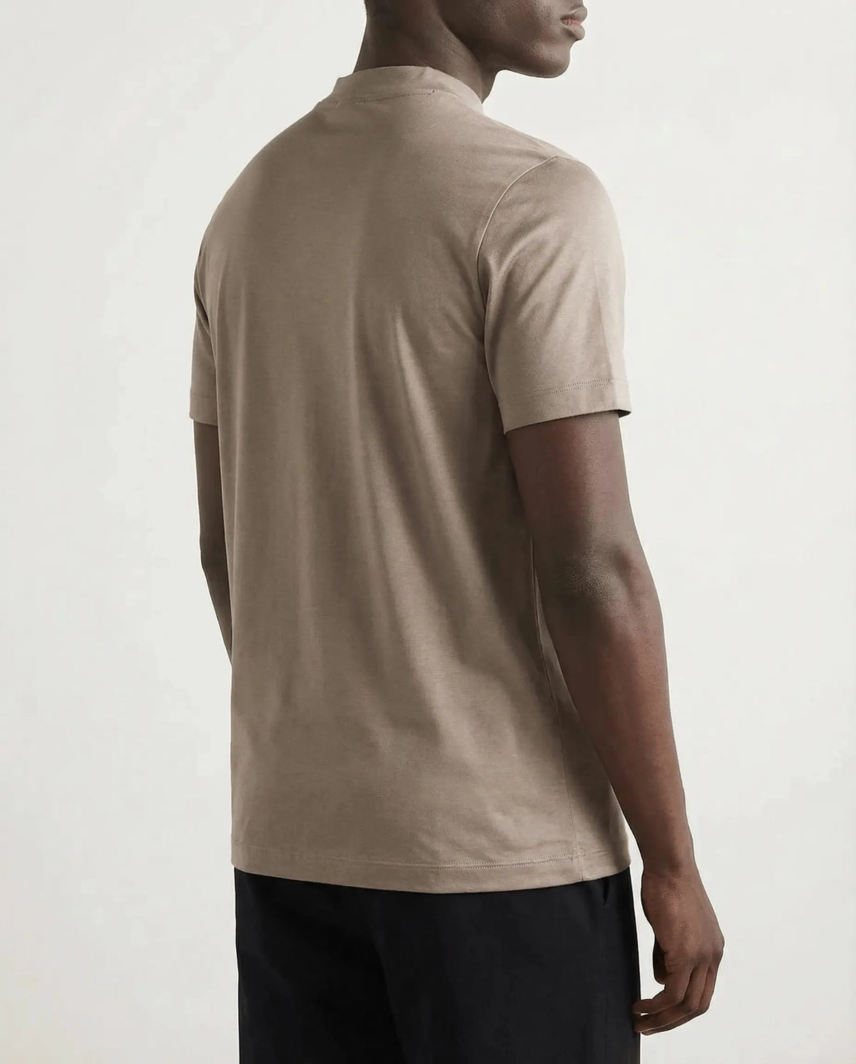 Back view of taupe t-shirt highlighting the lightweight drape across the shoulders