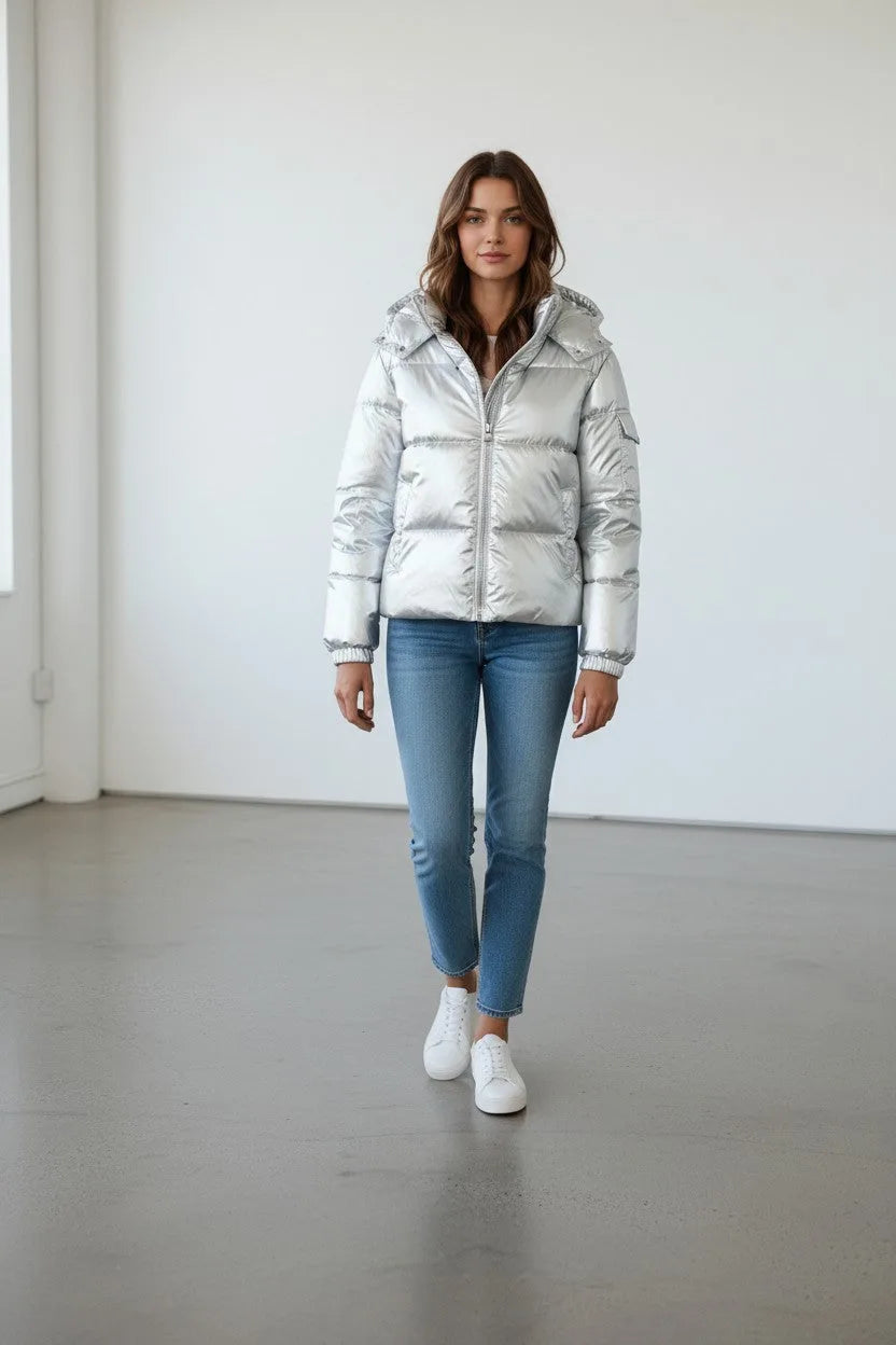 Full length front view of the silver puffer jacket styled with skinny jeans and white sneakers