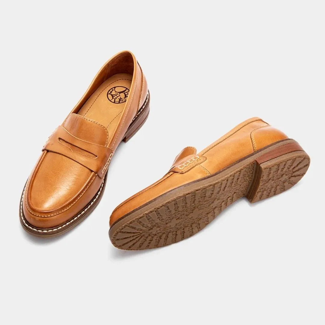 Top-down and sole view pair of tan loafers displaying the branded insole and durable grip pattern