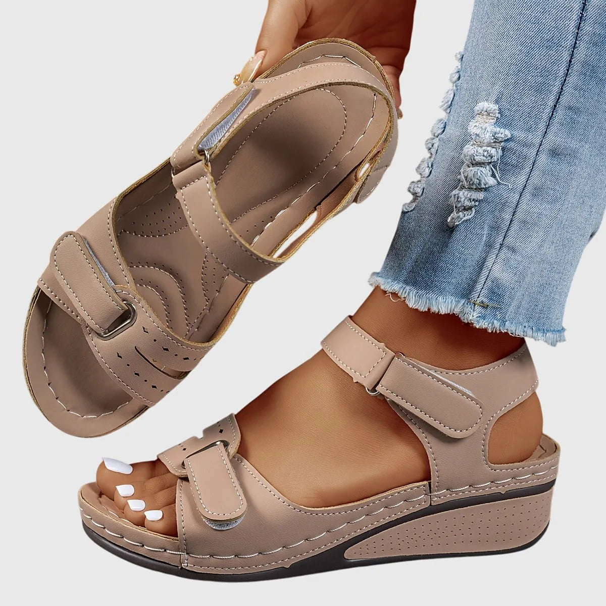 Khaki beige wedge sandal, close-up on the stacked wedge heel and ankle strap buckle