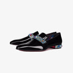Side pair view of glossy black patent loafers with a jewel-studded strap and matching crystal-embellished heel