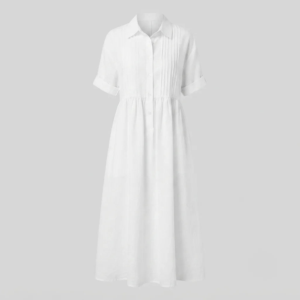 Flat lay product shot of the white pintuck maxi shirt dress showing the collar, button placket and pleated bodice detail