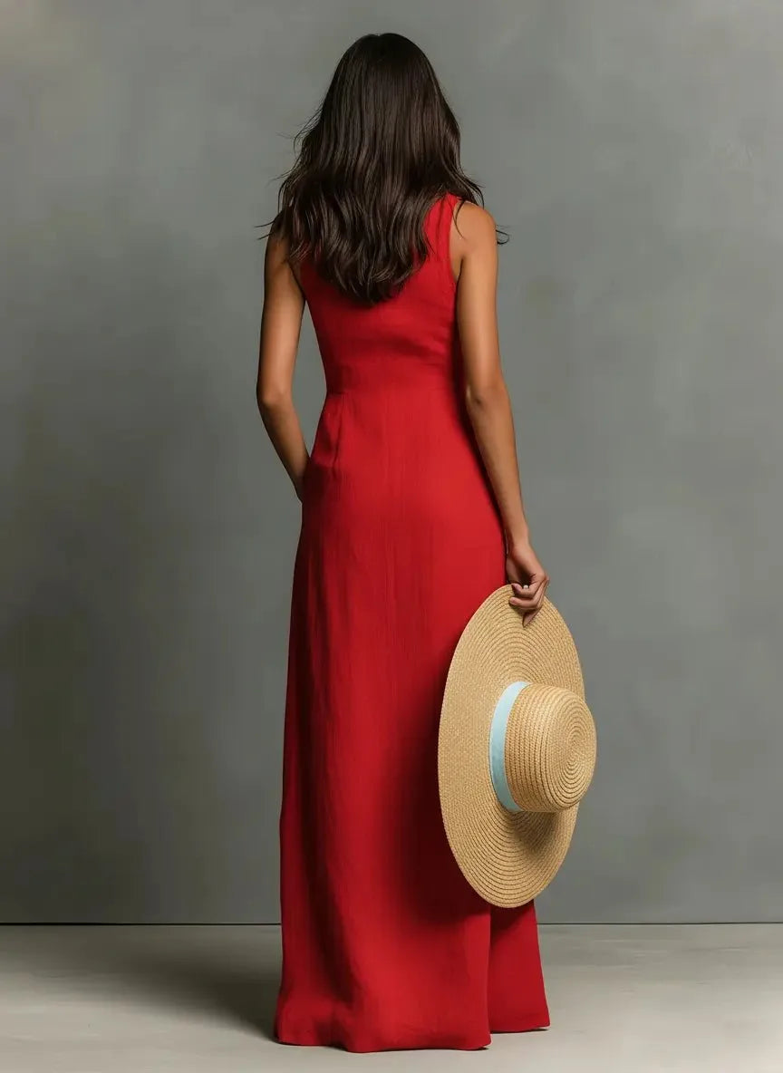Back view of the red sleeveless maxi dress showing the fitted waist and flowing floor-length skirt