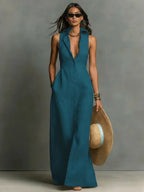 Front view of the deep teal blue sleeveless collared maxi dress with full button placket
