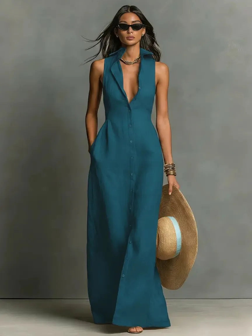 Front view of the deep teal blue sleeveless collared maxi dress with full button placket