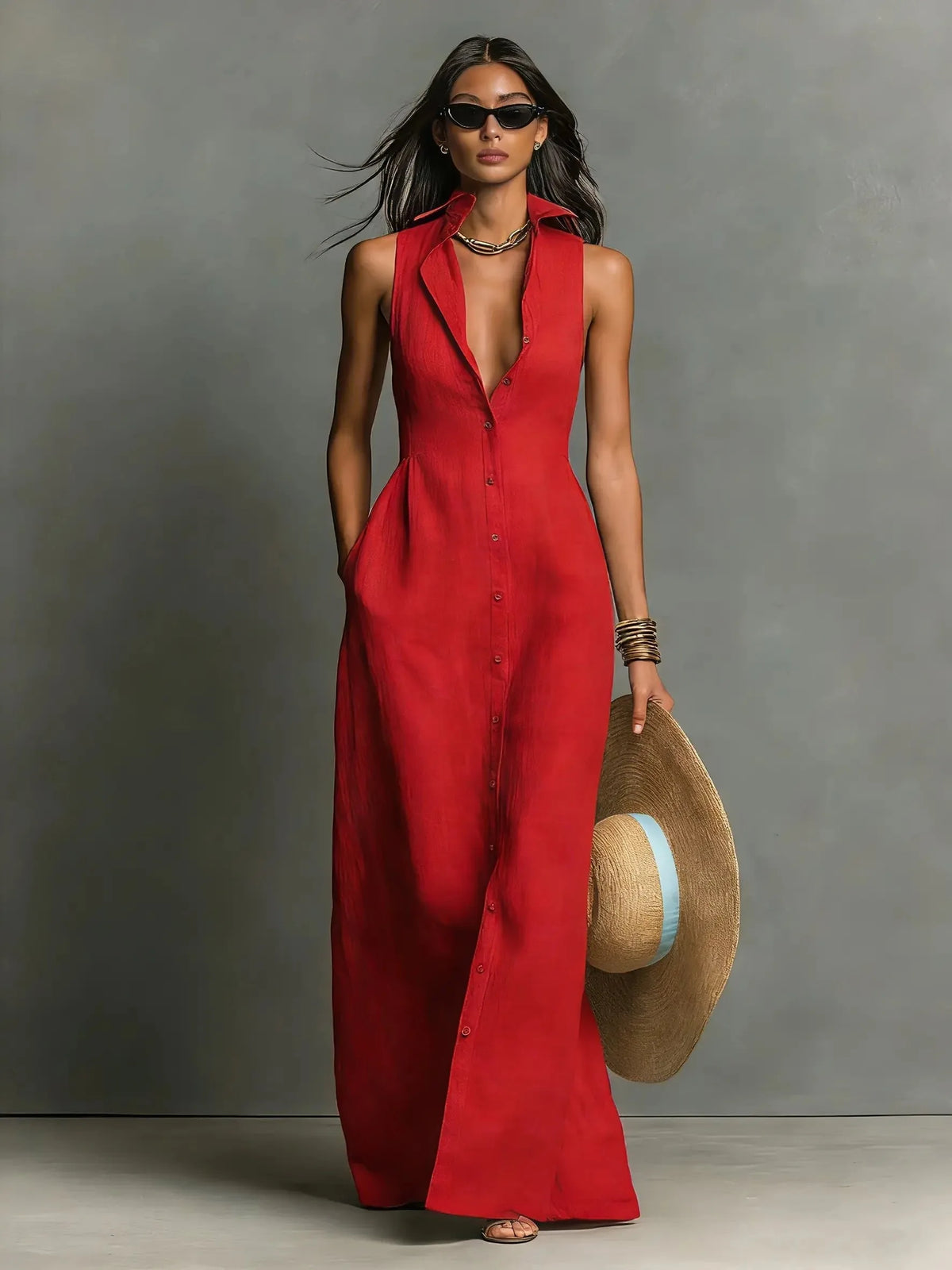 Full-length front view of the red sleeveless maxi dress showing the collar, buttons and ankle-strap sandals