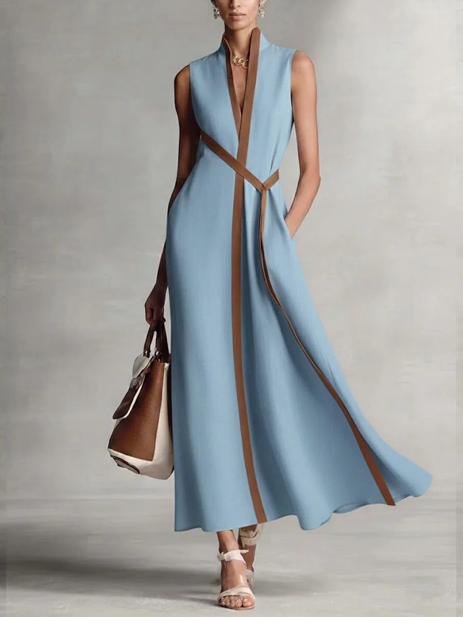 Pale blue sleeveless maxi dress with mandarin collar and tan contrast stripe running down the front
