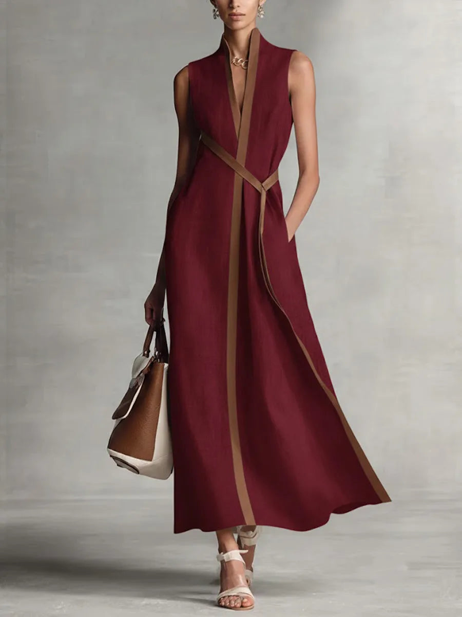 Burgundy sleeveless maxi dress with tan contrast trim, V-neckline and mandarin collar, full-length front view