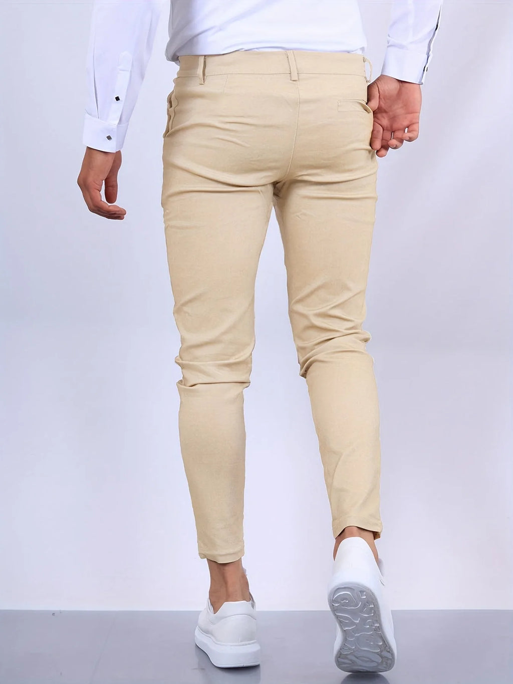 Full front view of slim tapered chino pants showing clean leg line from waist to ankle
