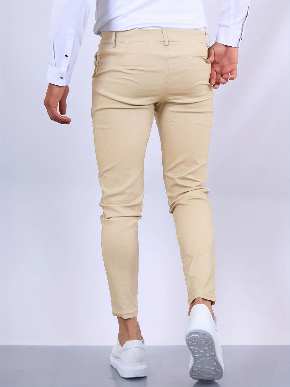 Full front view of slim tapered chino pants showing clean leg line from waist to ankle
