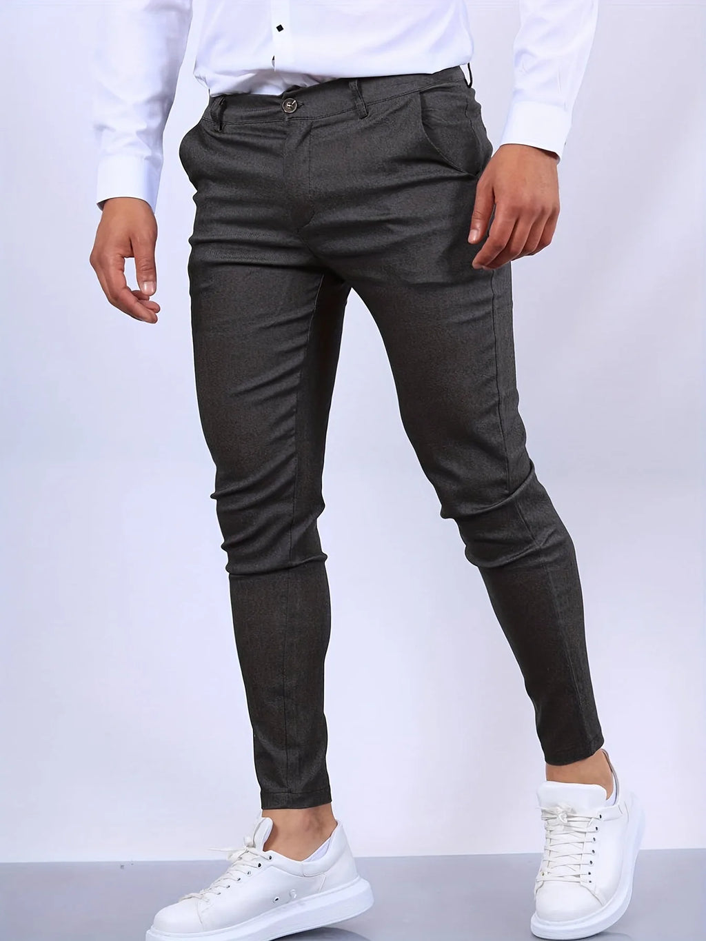 Side view of dark grey slim fit chino pants showing structured twill fabric texture