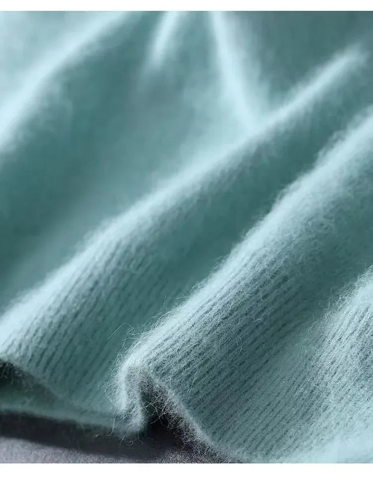 Detail shot of knit fabric texture highlighting the fine fibres and natural sheen of the material