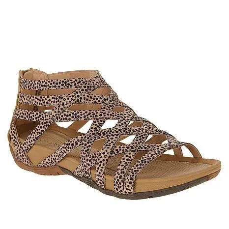 Leopard-print strappy gladiator sandal with cutout design, zip-up back and tan cushioned footbed.
