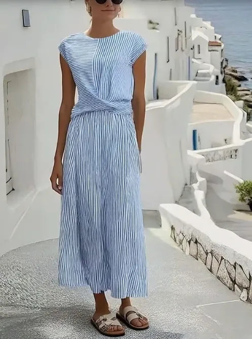 Front view of the striped linen-blend midi dress showing the cap sleeves, round neckline and gathered waist twist.
