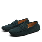 Top-down view of marine blue suede loafers showing the penny strap and clean upper profile