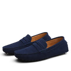 Side profile of brown suede loafers showing the low-cut vamp and relaxed slip-on fit