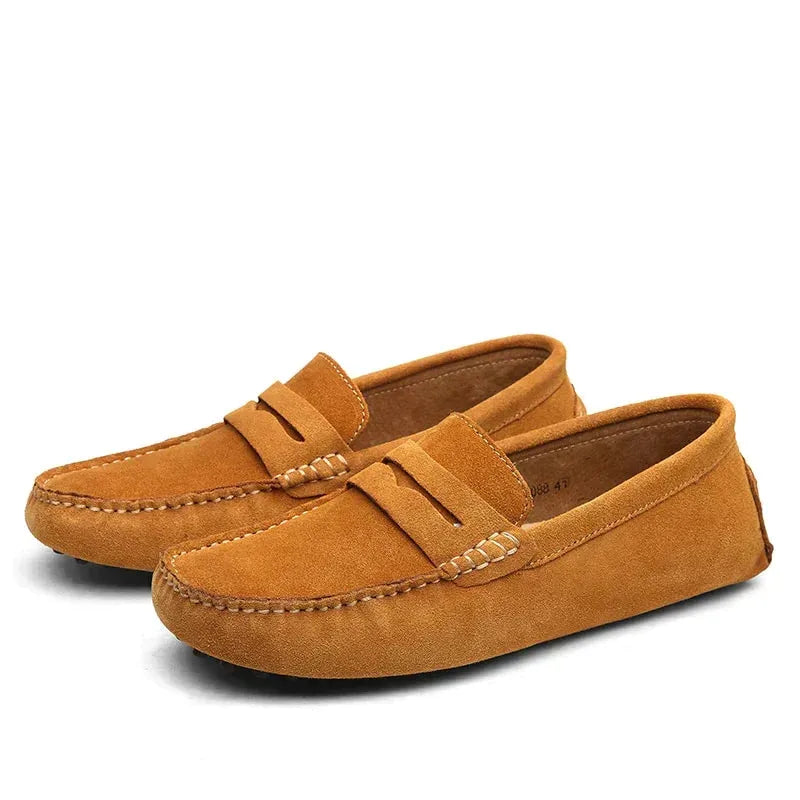 Light brown suede driving loafers with hand-stitched toe seam and tan interior lining