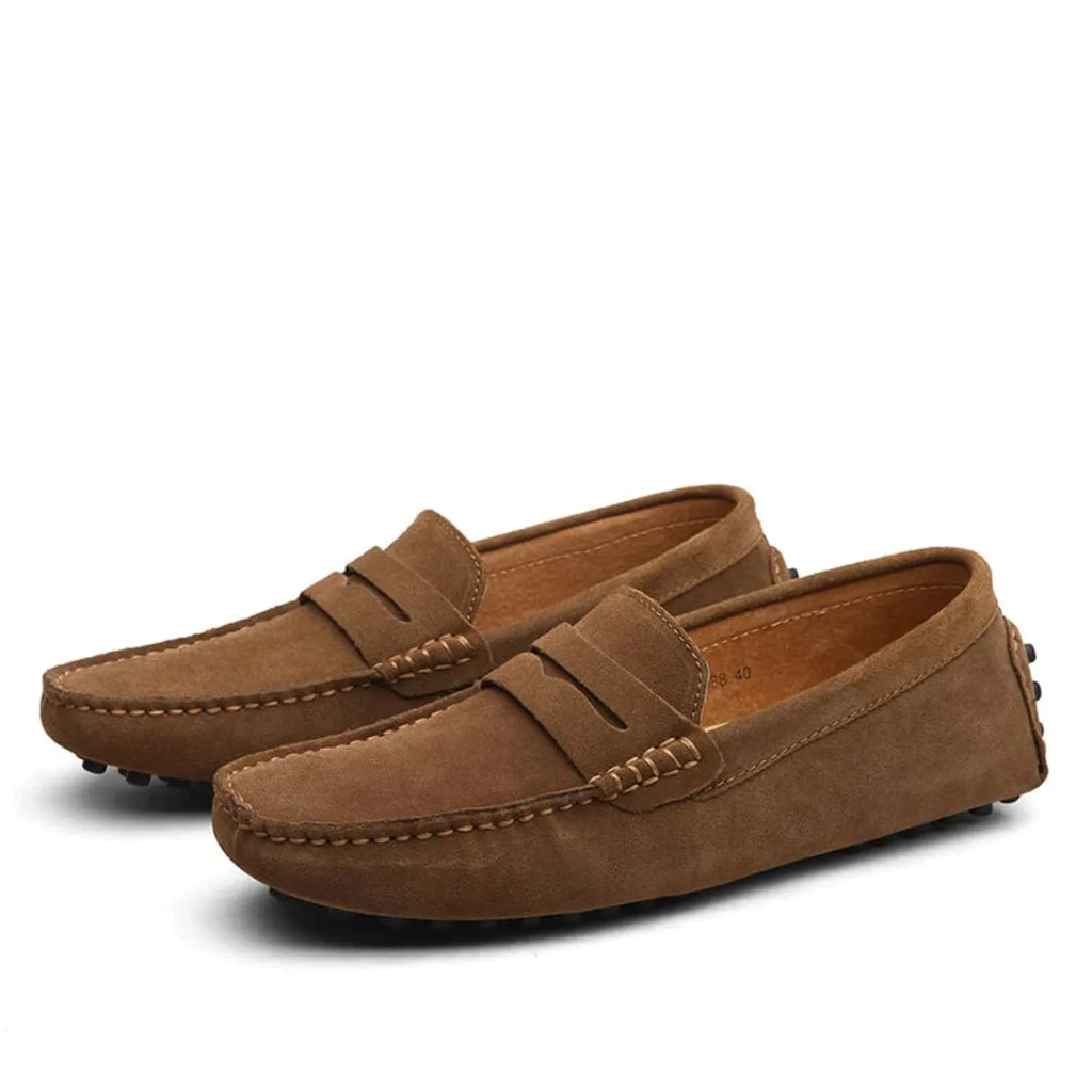 Front angled view of brown suede loafers showing the moccasin stitching and round toe shape