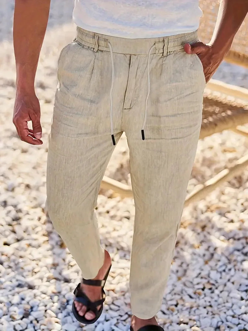 Khaki beige linen-blend pants shown from the waist down with drawstring tie and relaxed tapered fit
