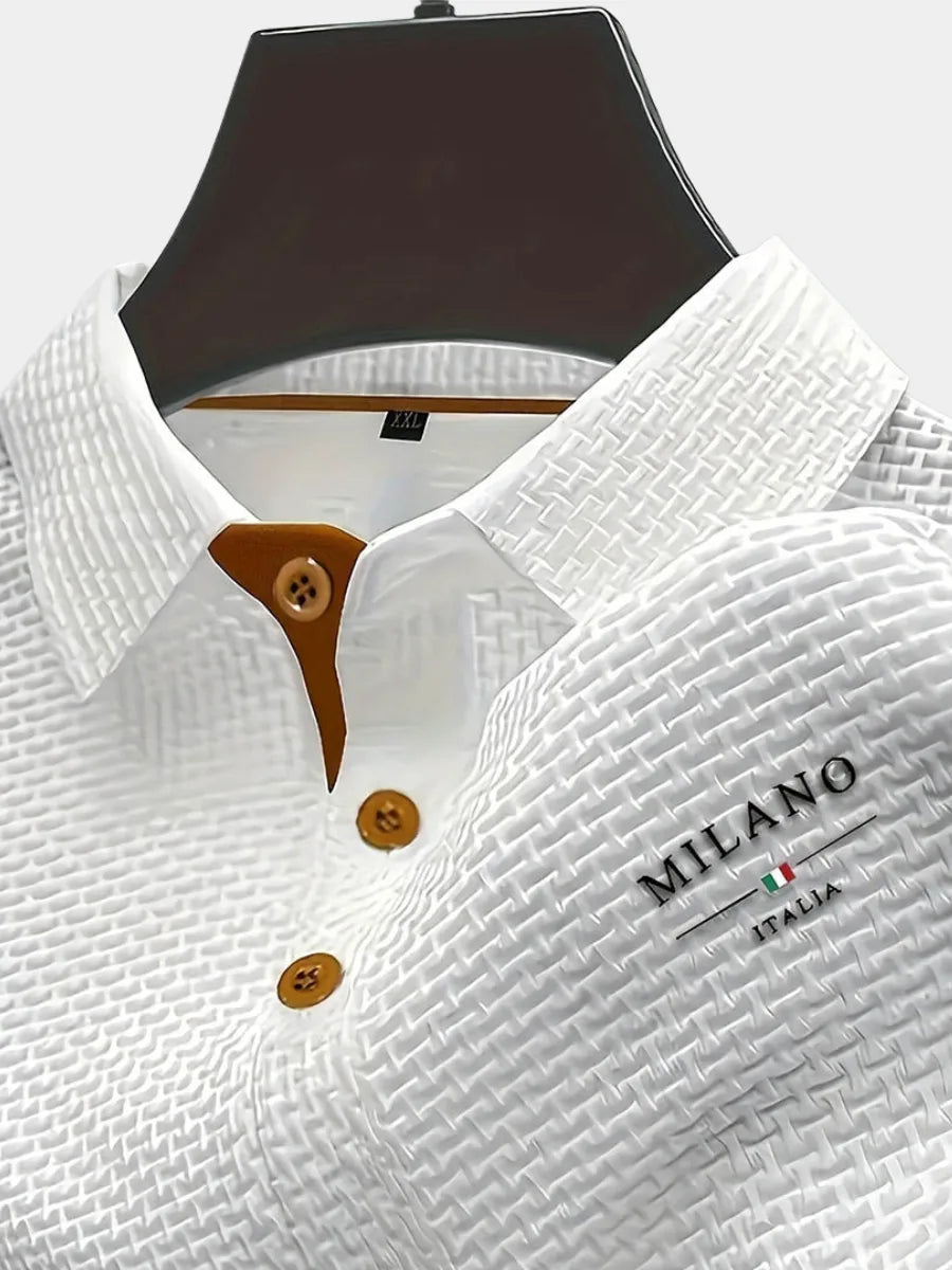 Close-up of a white textured woven polo shirt on a mannequin, showing tan button placket and collar detail