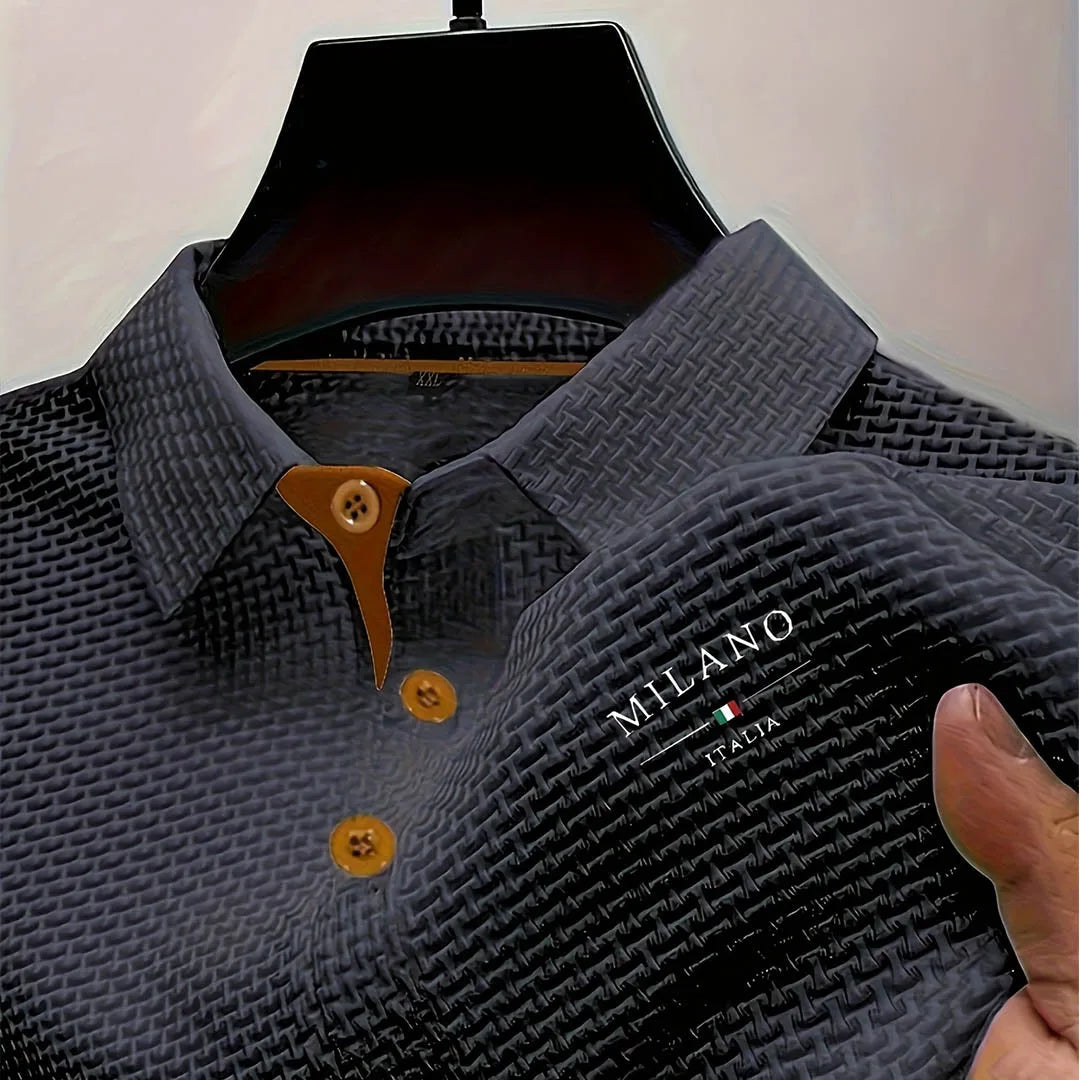 Grey textured polo shirt close-up showing woven fabric pattern and tan placket trim on collar
