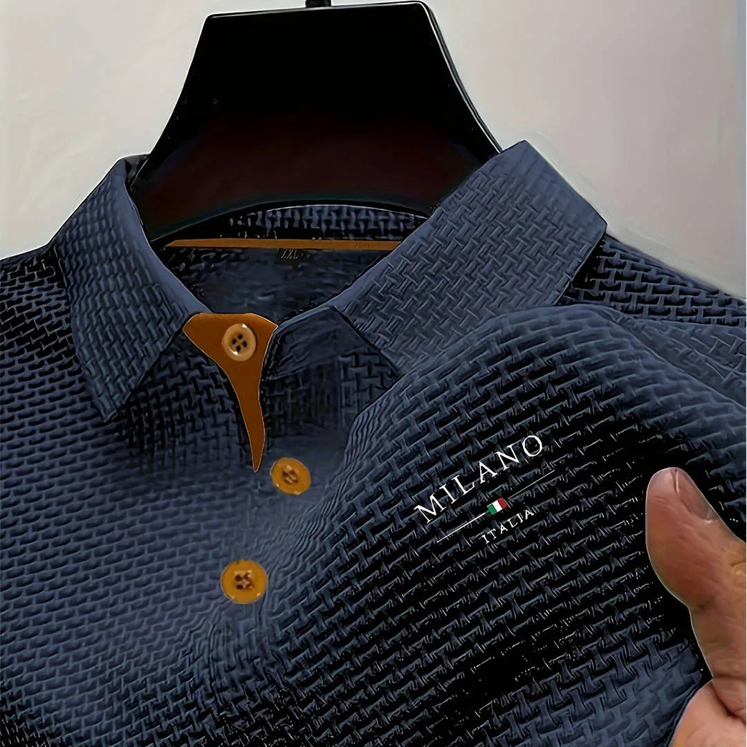 Navy blue textured polo shirt on hanger highlighting tan button detail and structured collar shape