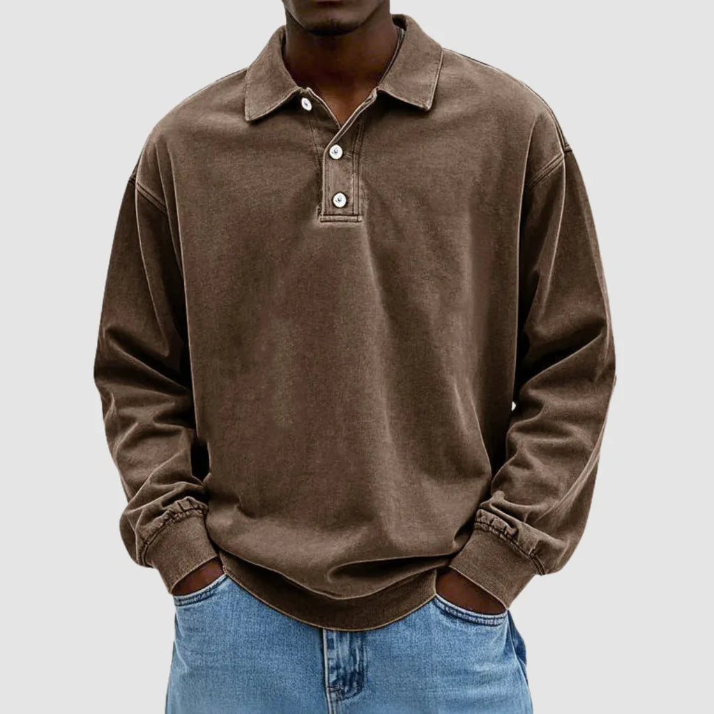 Brown vintage-wash long-sleeve polo top showing elasticated cuffs and relaxed drop-shoulder silhouette