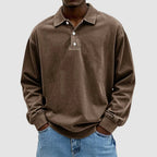Brown vintage-wash long-sleeve polo top showing elasticated cuffs and relaxed drop-shoulder silhouette