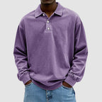 Purple washed long-sleeve collared polo top with relaxed fit, shown from the front against a plain backdrop