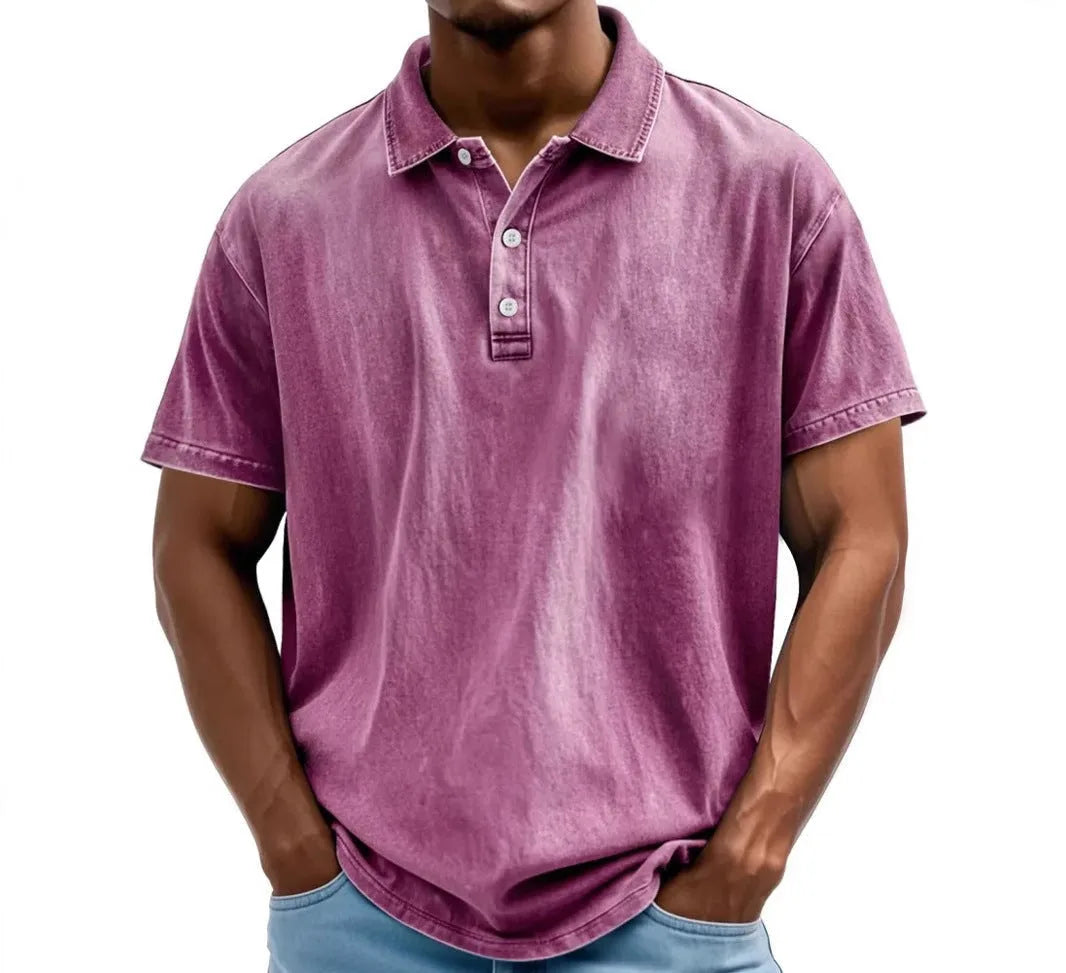 Side-angled view of washed polo shirt showing dropped shoulder seam and sleeve hem detail