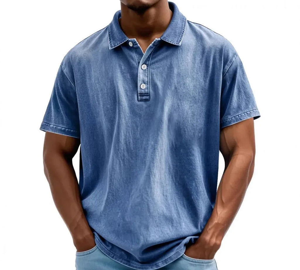 Mid-blue denim-look polo shirt with faded wash and button placket, close front view on model