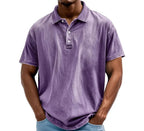 Purple washed polo shirt with three-button placket and short sleeves, front view on model