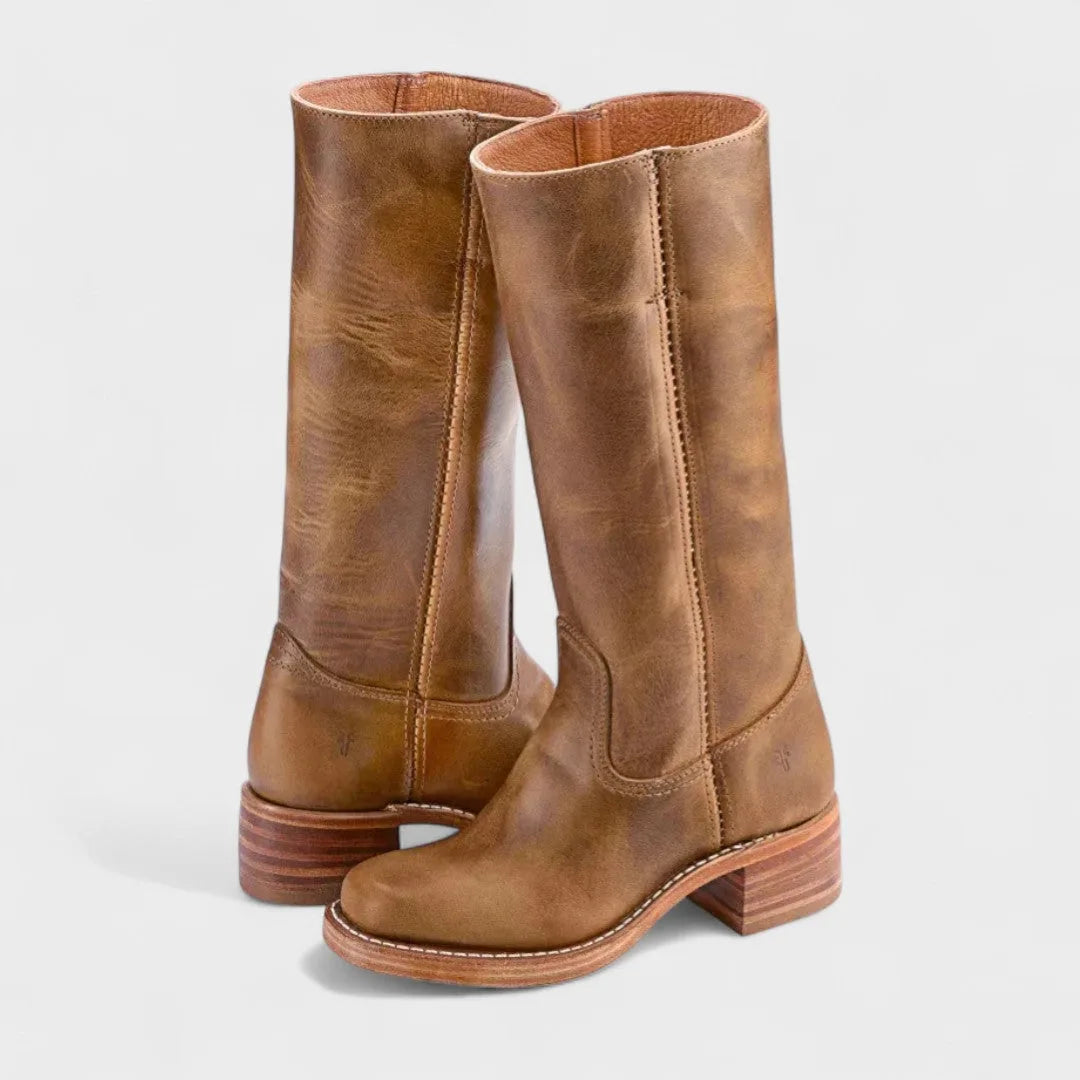 Light brown weathered leather boots showing stacked heel and tan leather sole detail
