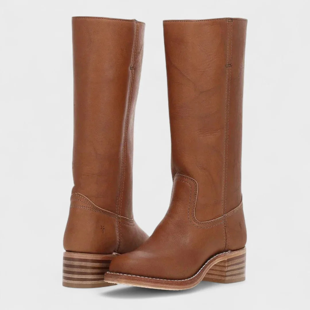 Tan brown leather boots shown from the front, highlighting the stacked wood-tone heel